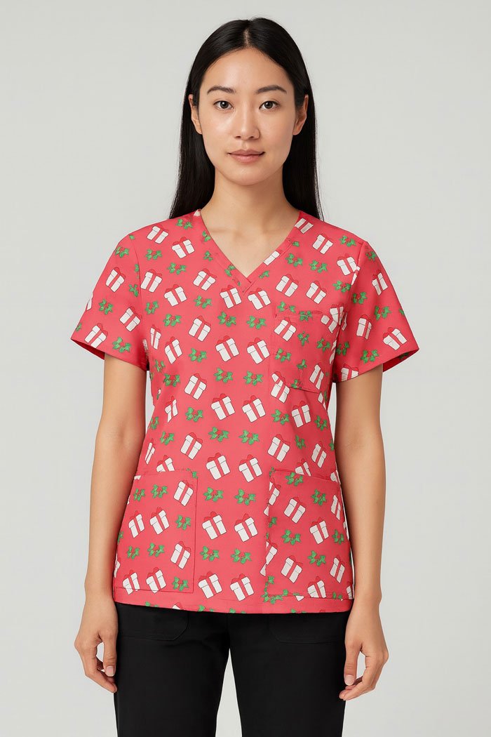 Holly Gift Christmas Scrub Top – Pink Holiday Medical Uniform with Gift & Mistletoe Print | Festive Scrubs for Nurses & Doctors